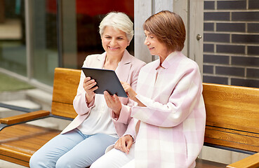 Image showing senior women with tablet computer in city