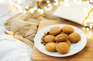 Image showing oatmeal cookies with almonds on plate at home