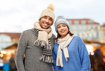 Image showing happy couple in winter clothes at christmas market