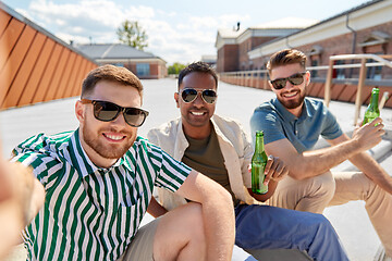 Image showing men drinking beer and taking selfie on street