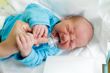 Image showing crying newborn baby infant in the hospital