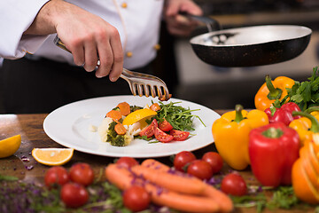 Image showing chef serving vegetable salad