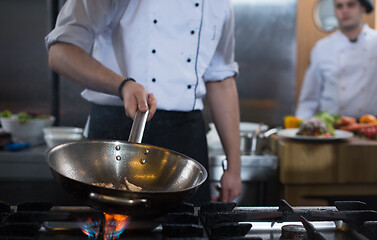 Image showing Chef doing flambe on food