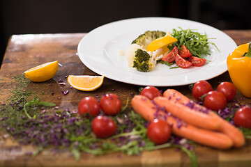 Image showing chef serving vegetable salad