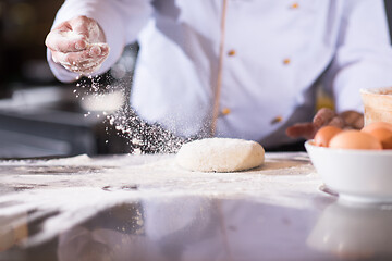 Image showing chef hands preparing dough for pizza