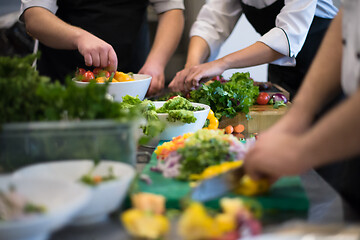 Image showing team cooks and chefs preparing meals