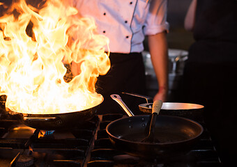 Image showing Chef doing flambe on food