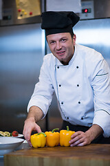 Image showing chef holding fresh peppers