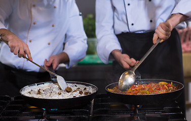 Image showing team cooks and chefs preparing meals