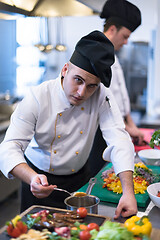 Image showing Chef finishing steak meat plate