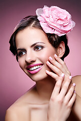 Image showing beautiful girl with rose in hair