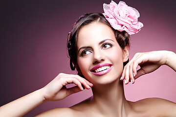 Image showing beautiful girl with rose in hair