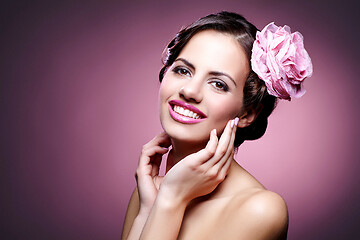 Image showing beautiful girl with rose in hair