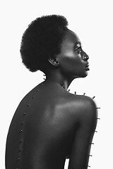 Image showing Beautiful black girl with metal pins