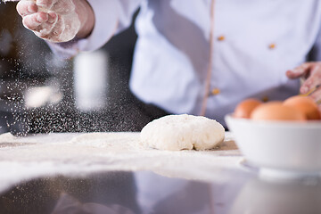Image showing chef hands preparing dough for pizza
