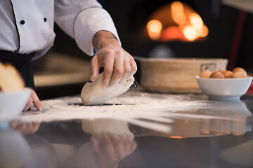 Image showing chef hands preparing dough for pizza