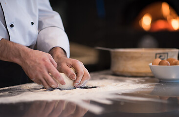 Image showing chef hands preparing dough for pizza