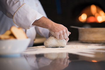 Image showing chef hands preparing dough for pizza