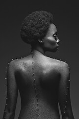 Image showing Beautiful black girl with metal pins