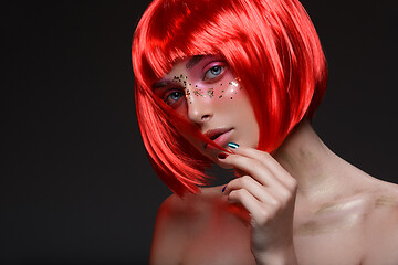 Image showing Beautiful girl in red wig