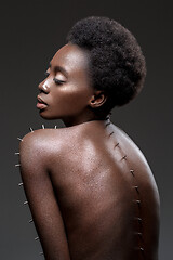 Image showing Beautiful black girl with metal pins