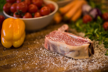 Image showing Juicy slice of raw steak on wooden table