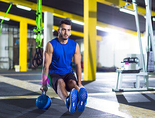 Image showing Young strong man doing pushups