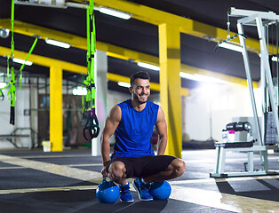 Image showing Young strong man doing pushups