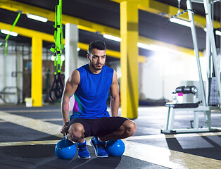 Image showing Young strong man doing pushups