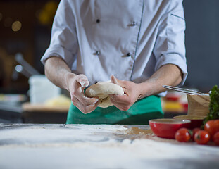 Image showing chef hands preparing dough for pizza