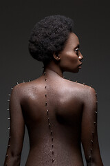 Image showing Beautiful black girl with metal pins