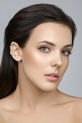 Image showing Beautiful girl with pearls on ear