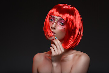 Image showing Beautiful girl in red wig