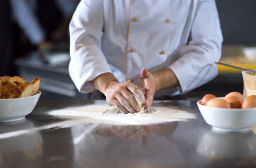 Image showing chef hands preparing dough for pizza