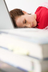 Image showing Sleeping caucasian female student