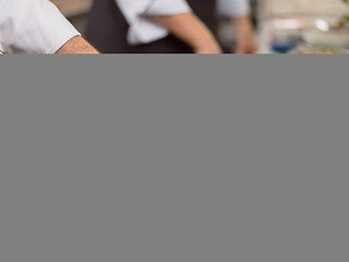 Image showing Chef hands preparing marinated Salmon fish