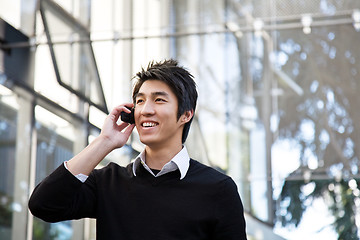 Image showing Casual asian businessman on the phone