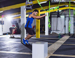 Image showing man working out jumping on fit box