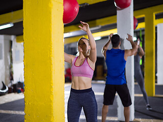 Image showing young athletes working out with medical ball