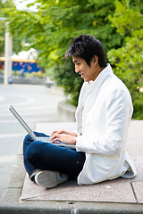 Image showing Asian college student and laptop