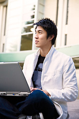 Image showing Asian college student and laptop