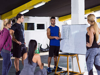 Image showing athletes getting instructions from trainer