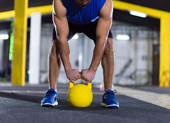 Image showing man exercise with fitness kettlebell