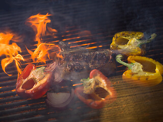 Image showing steak with vegetables on a barbecue