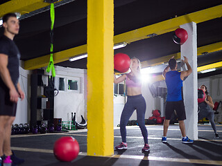 Image showing young athletes working out with medical ball