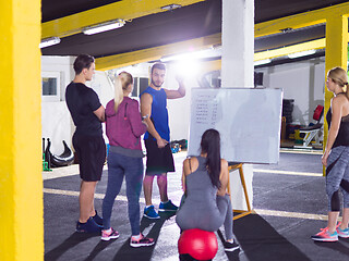 Image showing athletes getting instructions from trainer