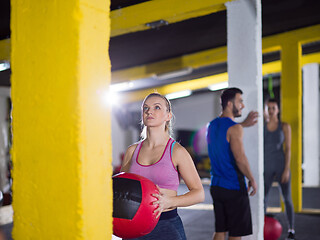 Image showing young athletes working out with medical ball