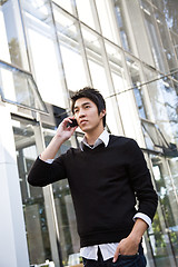 Image showing Casual asian businessman on the phone