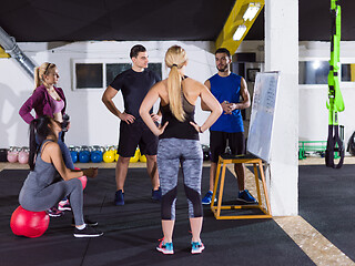 Image showing athletes getting instructions from trainer