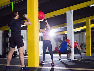 Image showing young athletes working out with medical ball